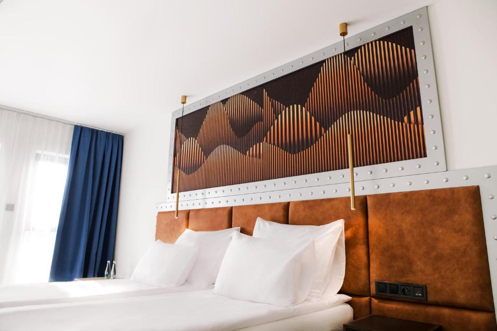 Postel nebo postele na pokoji v ubytování Hotel M23