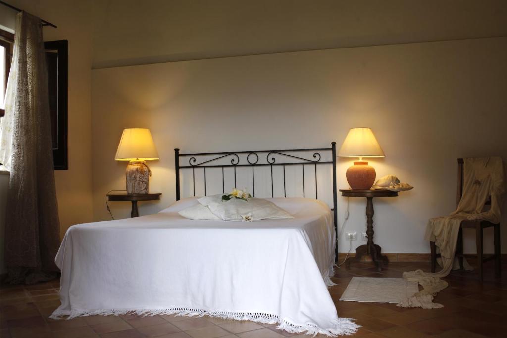 En eller flere senge i et værelse på Pozzo Di Mazza