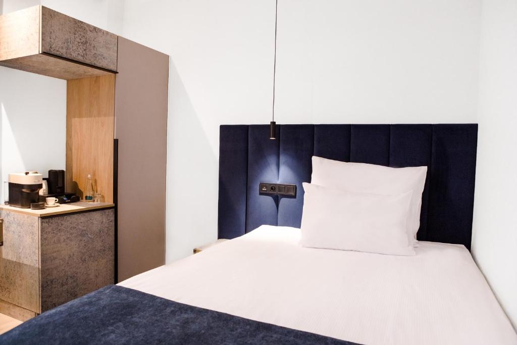Postel nebo postele na pokoji v ubytování Hotel M23