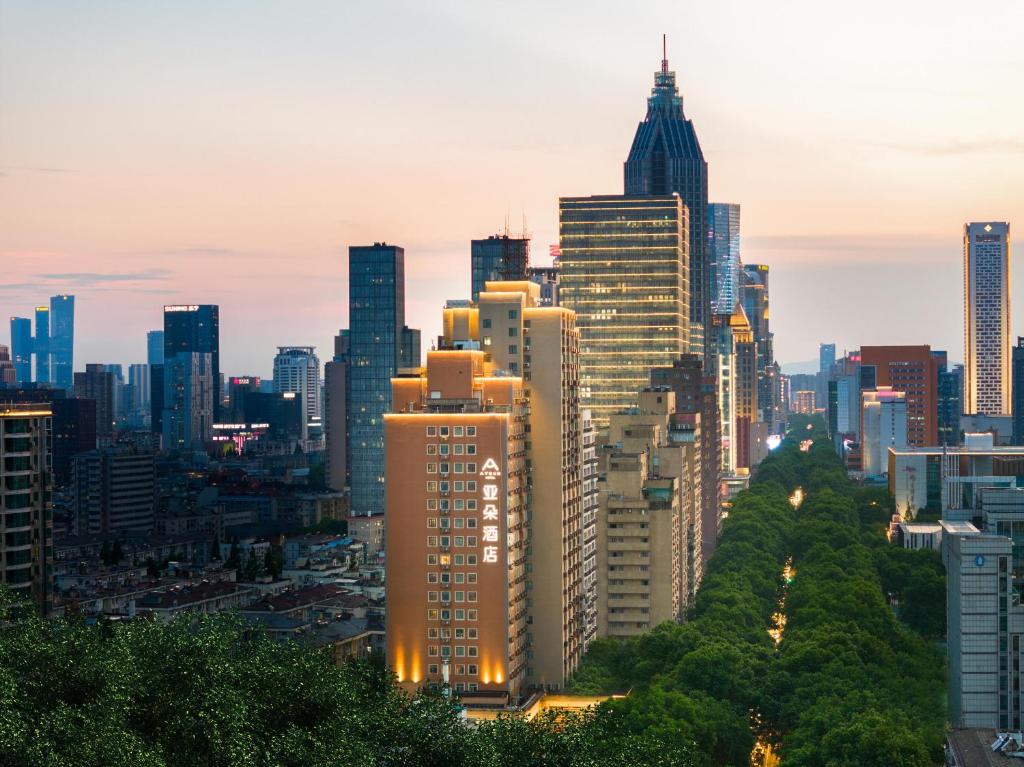 a city skyline with tall skyscrapers at Atour Hotel Presidential Residence Nanjing in Nanjing