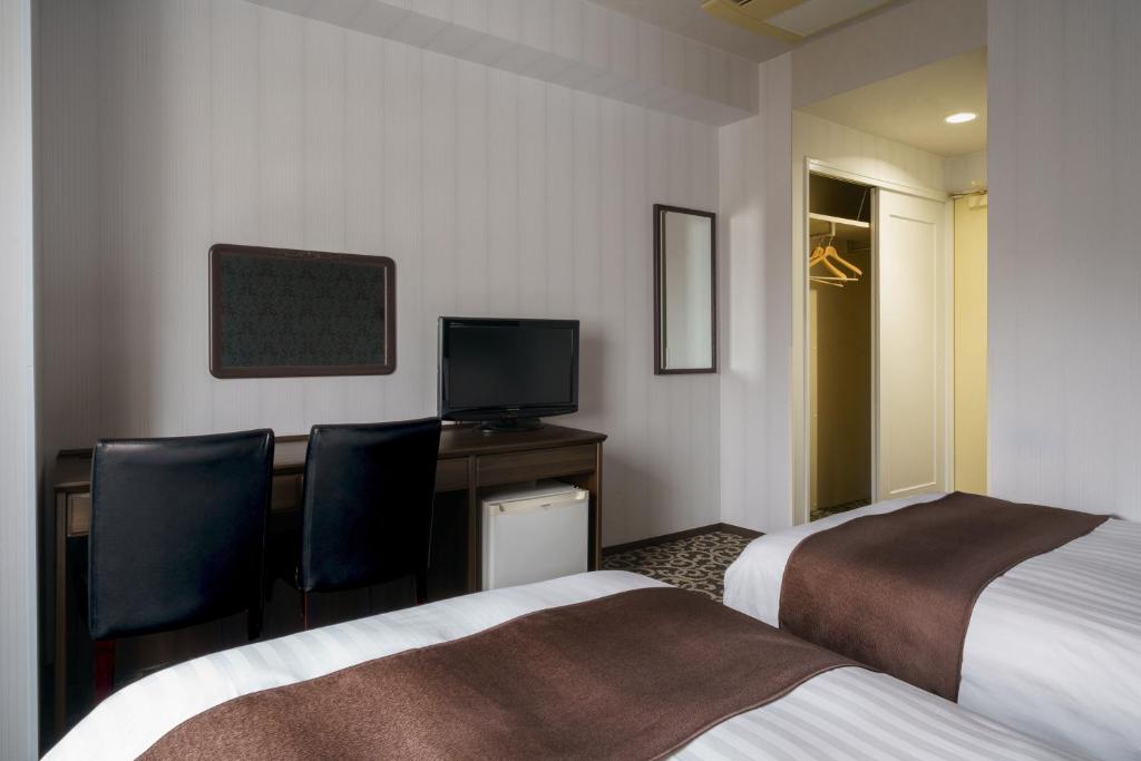 TV a/nebo společenská místnost v ubytování Hotel Centmain Nagoya