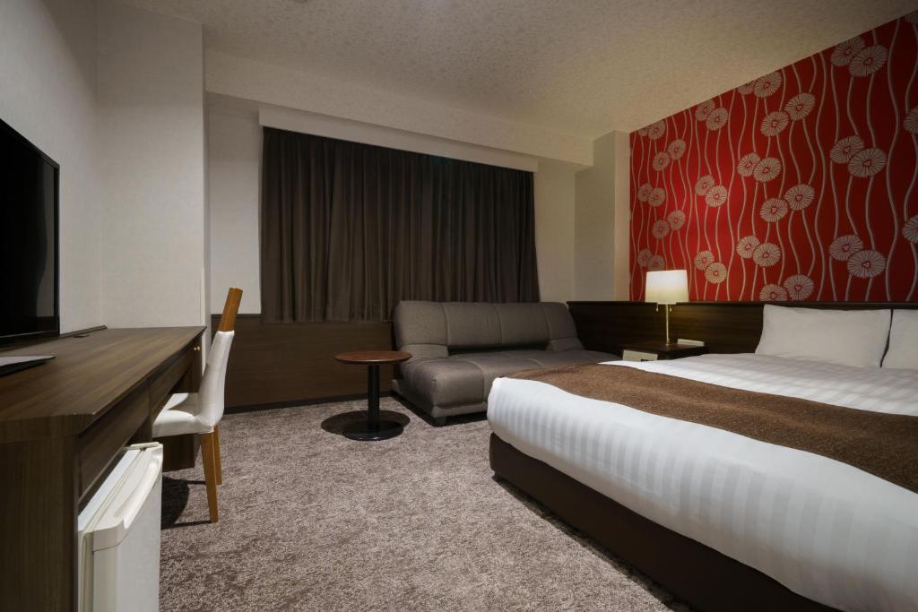Postel nebo postele na pokoji v ubytování Hotel Centmain Nagoya