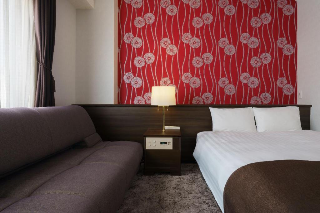 Postel nebo postele na pokoji v ubytování Hotel Centmain Nagoya