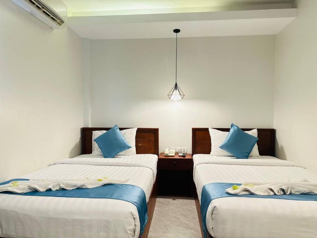 Postel nebo postele na pokoji v ubytování Laluna Guesthouse