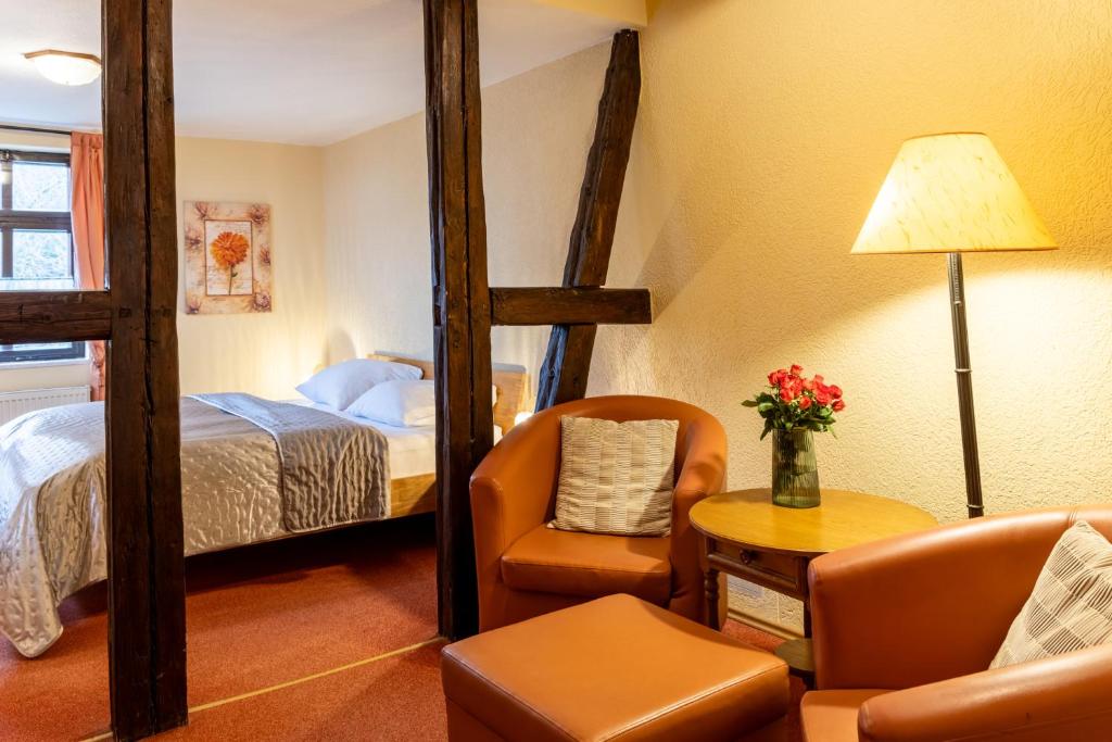 Postel nebo postele na pokoji v ubytování Schlossberg-Hotel Garni