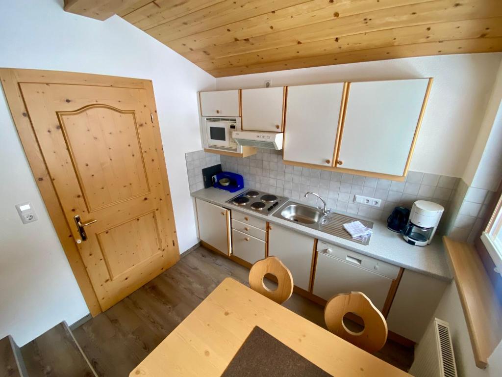Kuchyň nebo kuchyňský kout v ubytování Apartment Seespitz