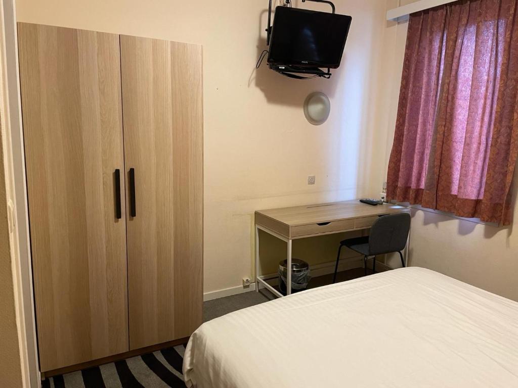 Postel nebo postele na pokoji v ubytování Hotel Bristol Internationaal