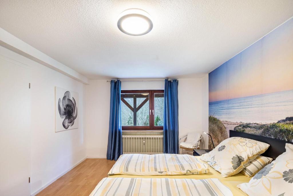 Postel nebo postele na pokoji v ubytování Ferienwohnung Waldeckchen