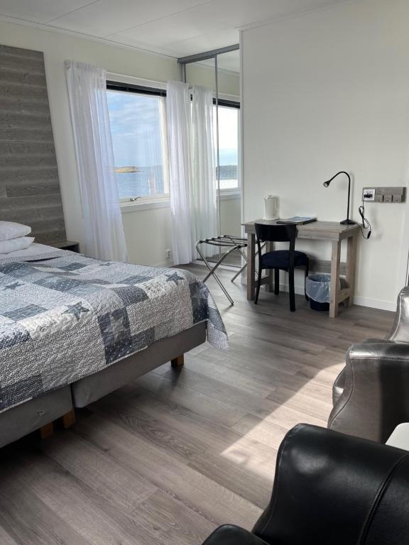 Postel nebo postele na pokoji v ubytování Hotell Fisketången