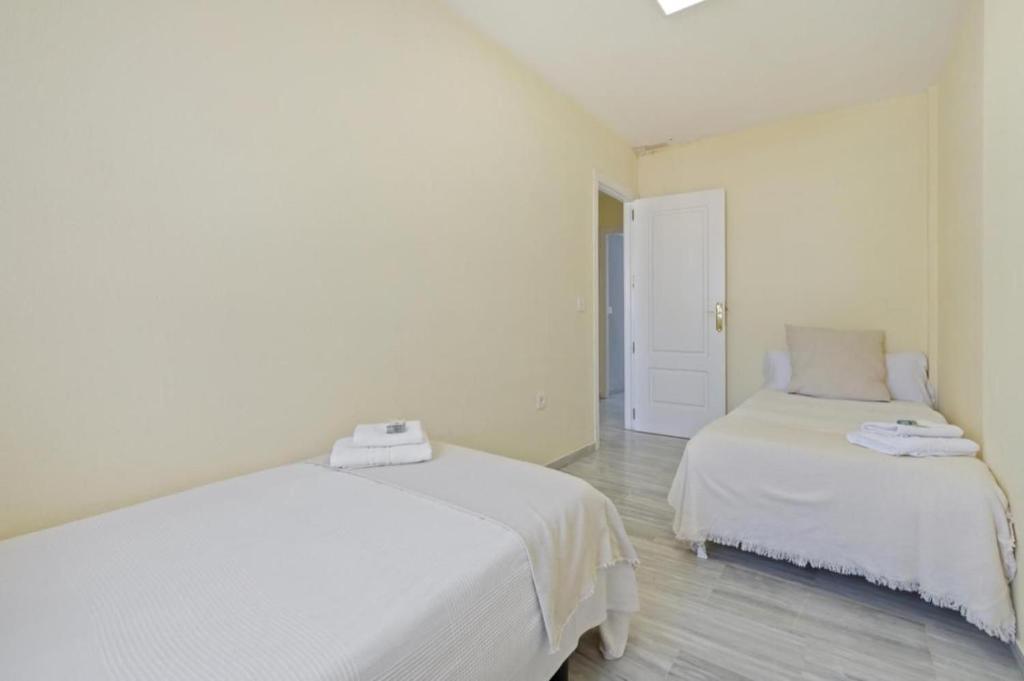Posteľ alebo postele v izbe v ubytovaní Apartamento en calle cuarteles de dos habitaciones