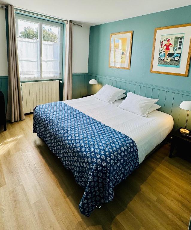 Postel nebo postele na pokoji v ubytování Hotel L'Océan