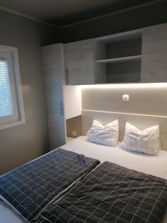 Postel nebo postele na pokoji v ubytování GF Mobilehomes Kroatien