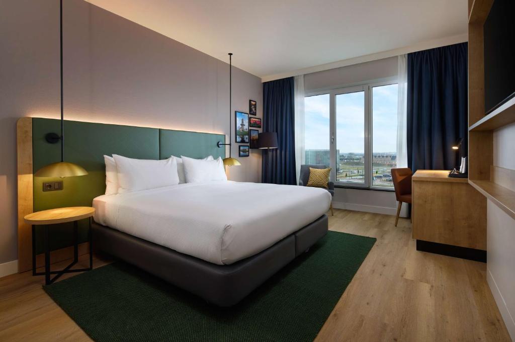 Postel nebo postele na pokoji v ubytování Hilton Garden Inn Leiden