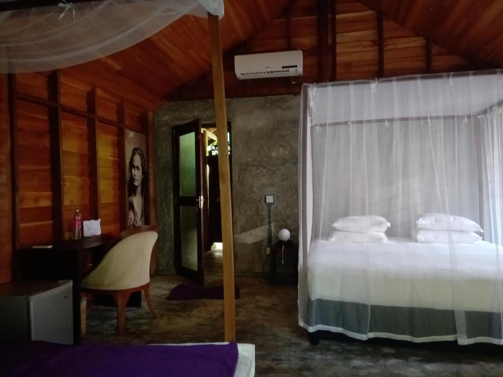 Postel nebo postele na pokoji v ubytování Turtle Eco Beach