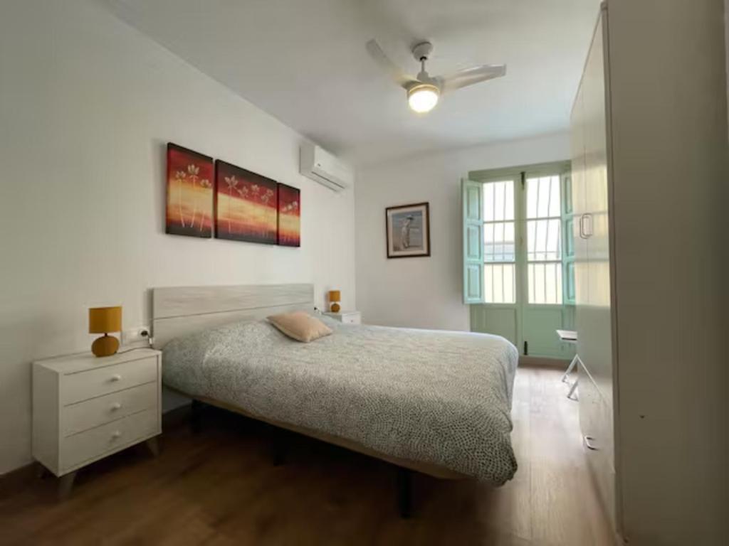 A bed or beds in a room at La Casita del Marqués