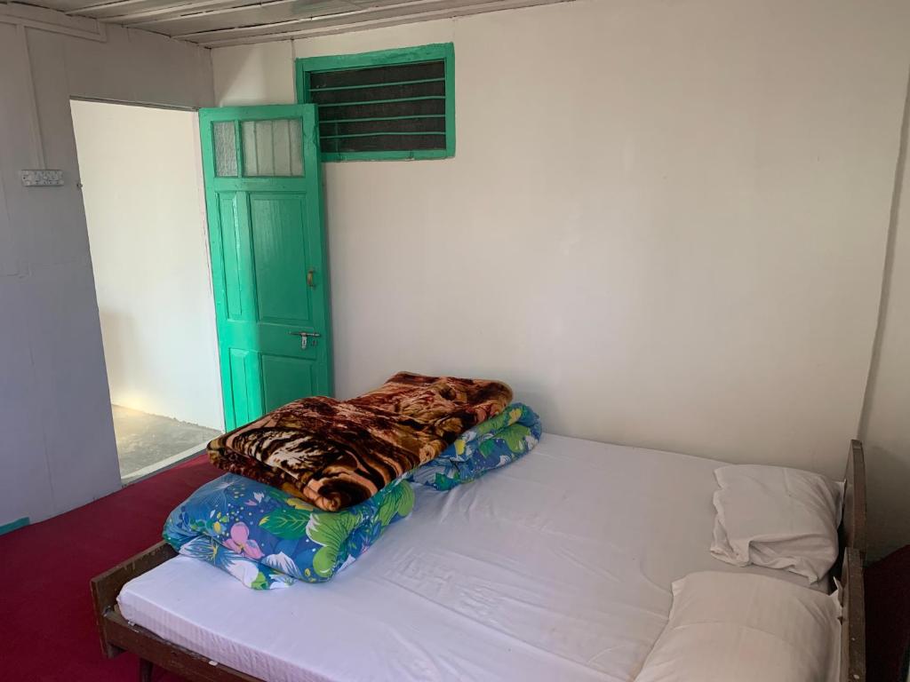 Postel nebo postele na pokoji v ubytování Hotel EMBASSY
