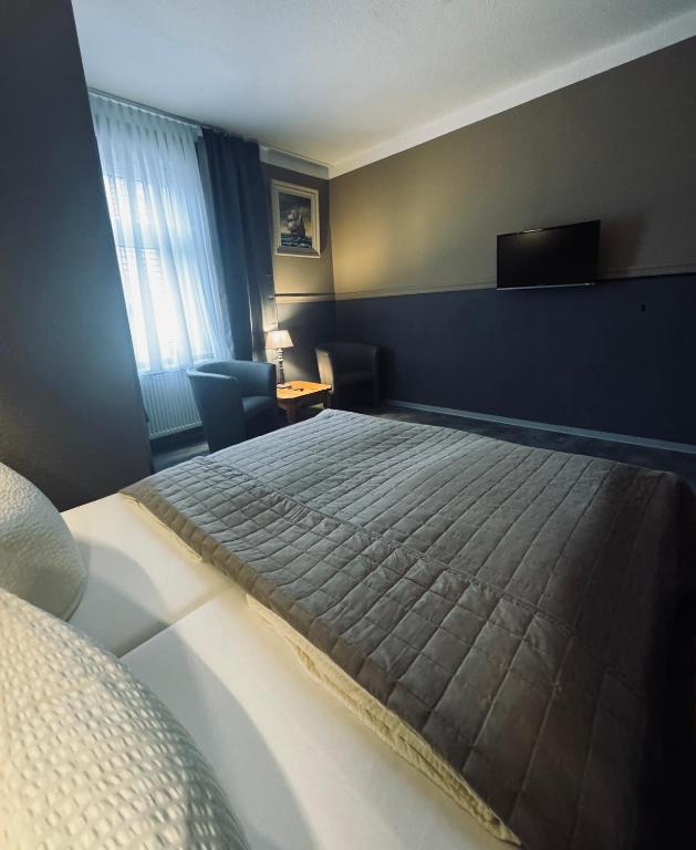 Postel nebo postele na pokoji v ubytování Hotel Garni „zum Bären“