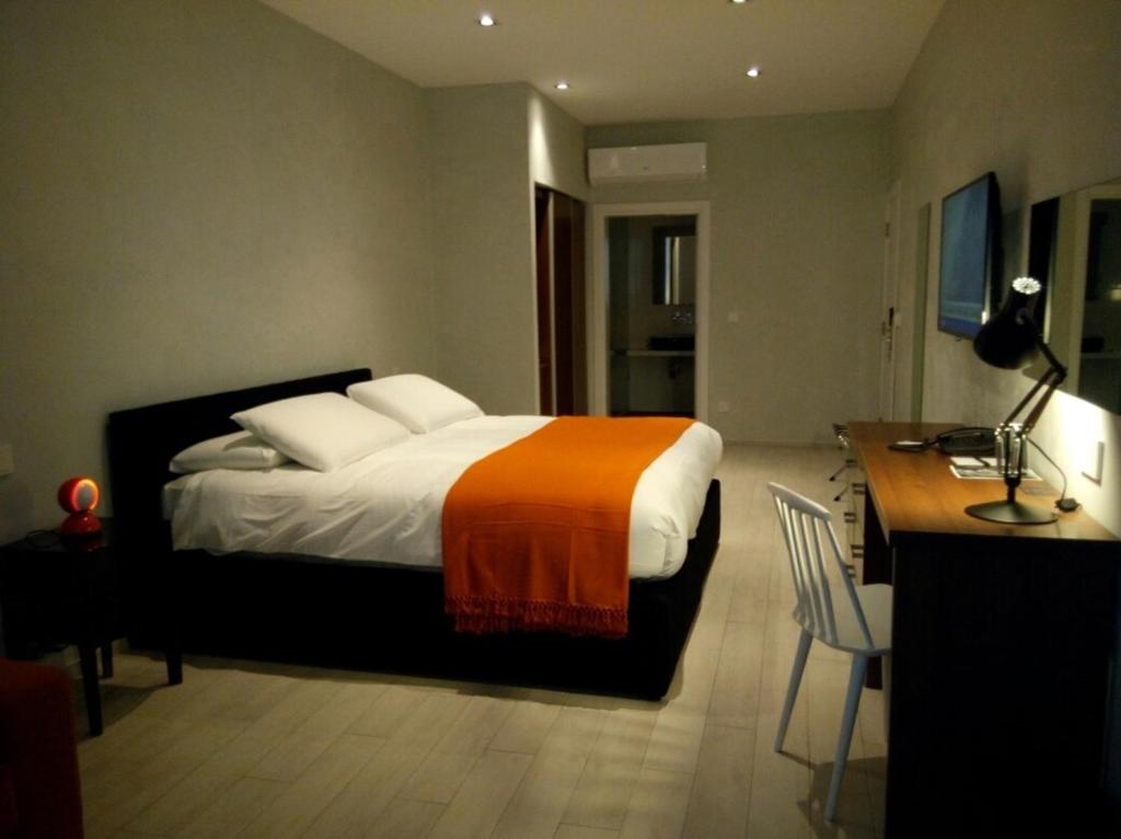 Postel nebo postele na pokoji v ubytování Quaint Boutique Hotel Sannat