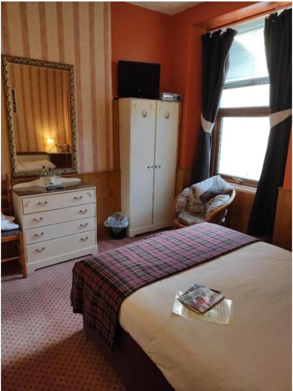 Postel nebo postele na pokoji v ubytování All Seasons Guesthouse