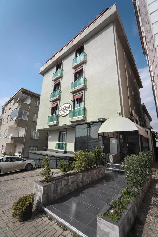 a building with an umbrella in front of it at Arkem City Hotel in Istanbul