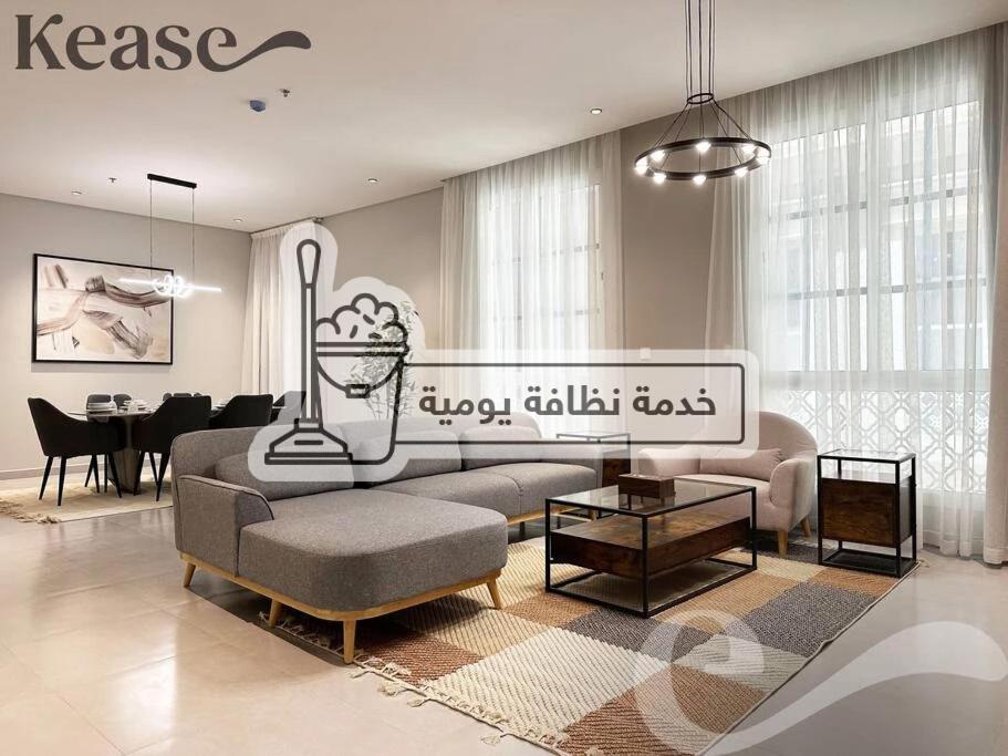a living room with a couch and a table at Kease Ar Rabi F-7 Luxurious Creativity GX12 in Riyadh