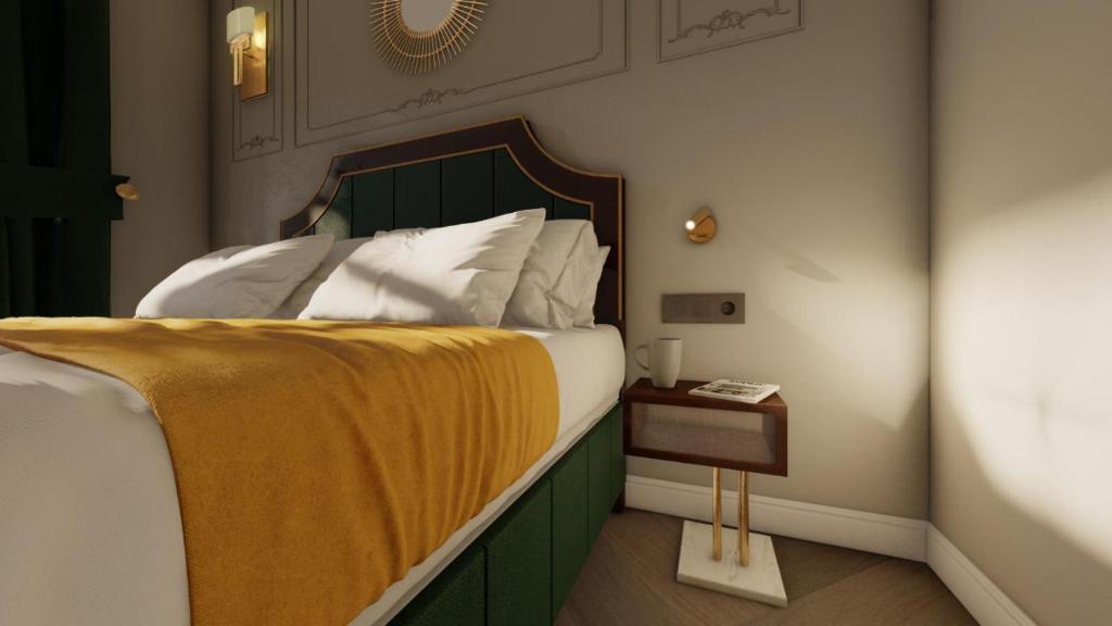 Postel nebo postele na pokoji v ubytování Hotel Ratsmühle Lüneburg