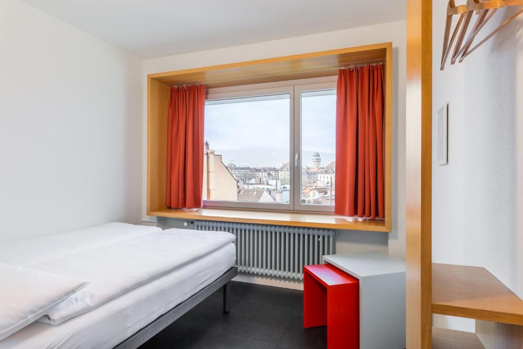 Posteľ alebo postele v izbe v ubytovaní Hotel Marta