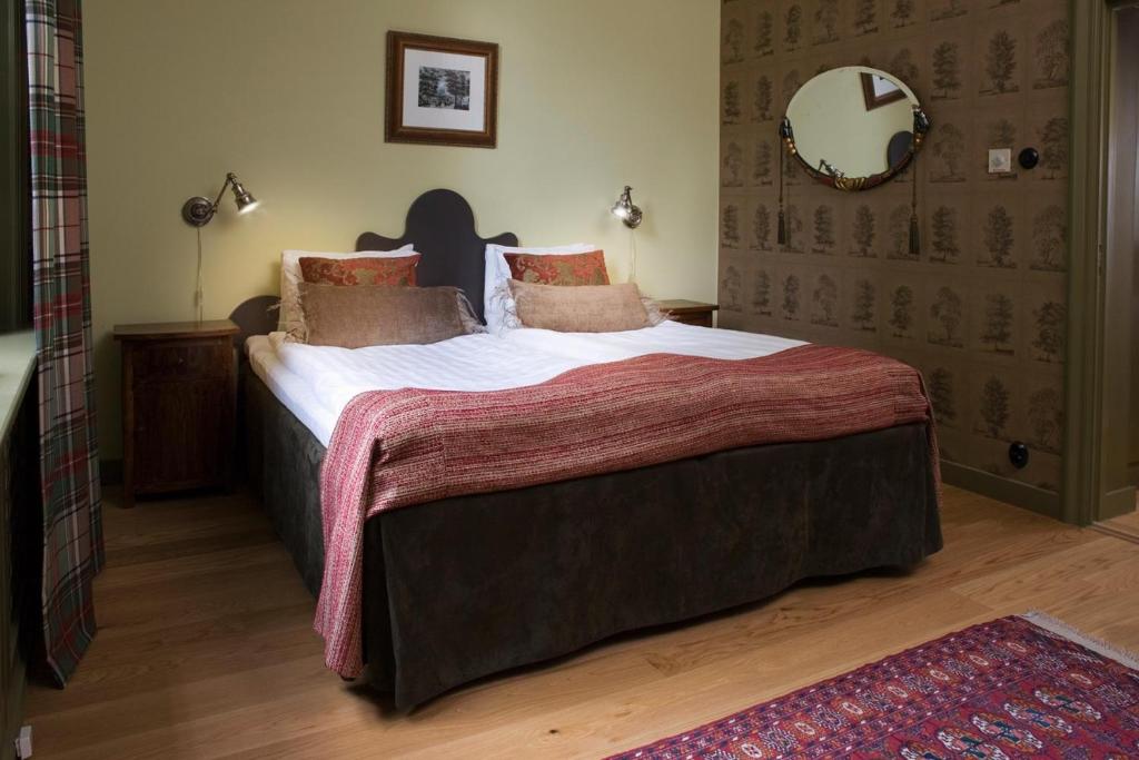 Postel nebo postele na pokoji v ubytování Finspång Slott