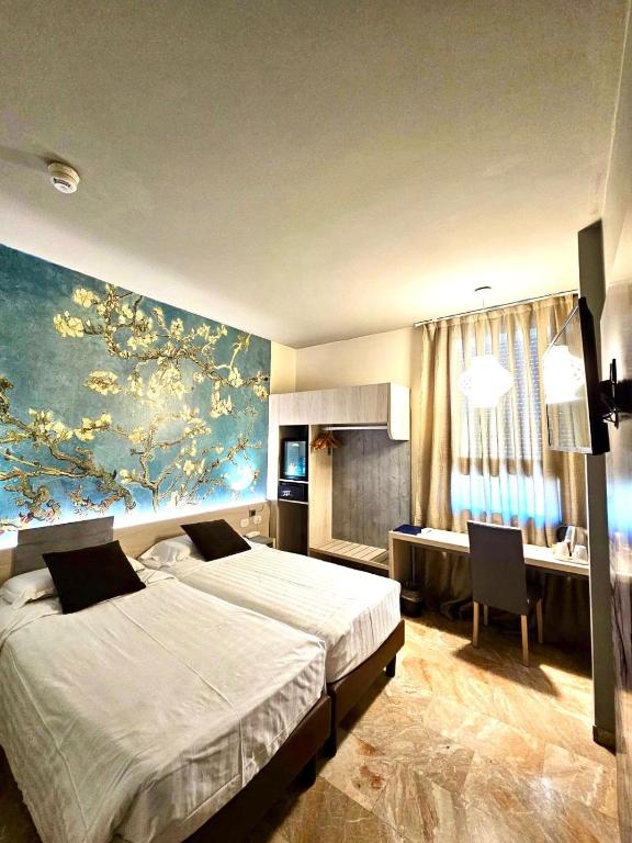 Postel nebo postele na pokoji v ubytování Canova Hotel