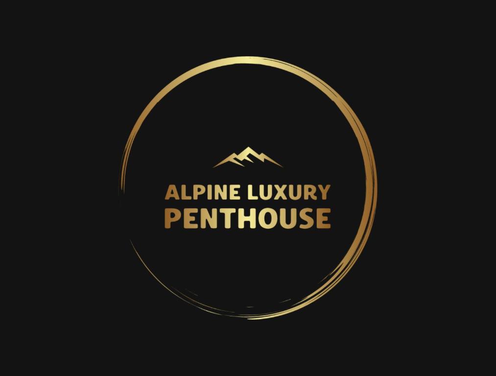 un logo de oro con una montaña en el medio en Luxury Penthouse - Between Kronplatz, 3 Peaks Dolomites and Lake Prags en Monguelfo