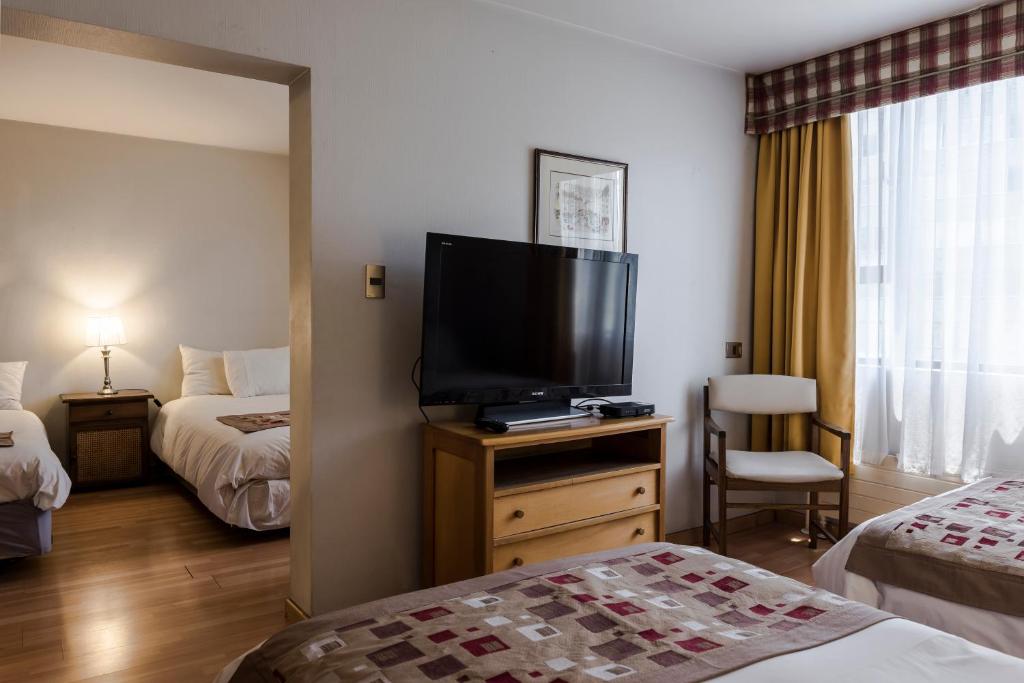 Postel nebo postele na pokoji v ubytování Hotel Nippon y Centro de Eventos