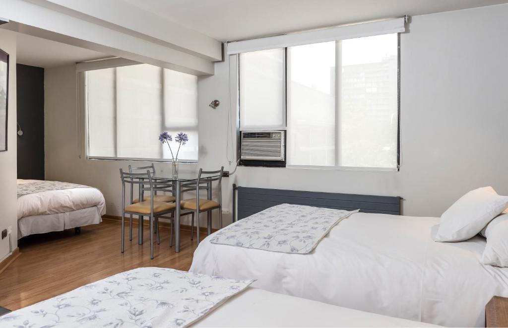 Postel nebo postele na pokoji v ubytování Hotel Nippon y Centro de Eventos