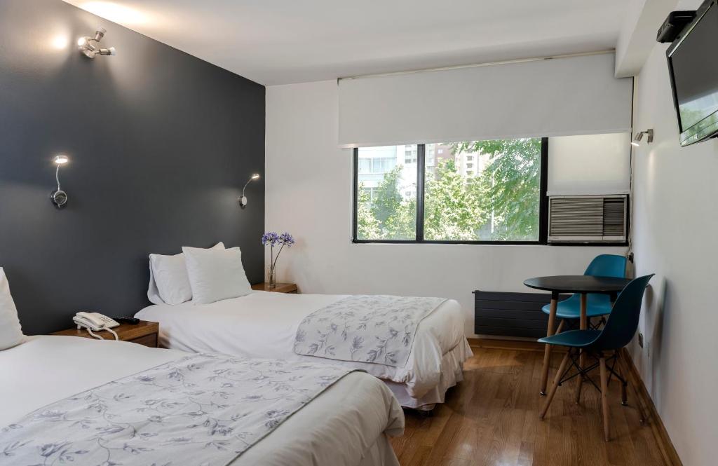 Postel nebo postele na pokoji v ubytování Hotel Nippon y Centro de Eventos
