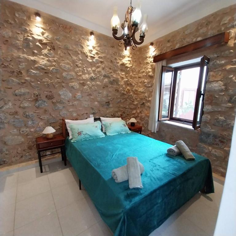 Ένα ή περισσότερα κρεβάτια σε δωμάτιο στο Grandpa's home