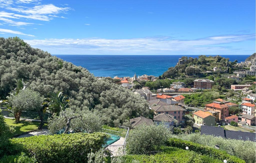 a view of a town with the ocean in the background at 2 Bedroom Stunning Apartment In Moneglia in Moneglia