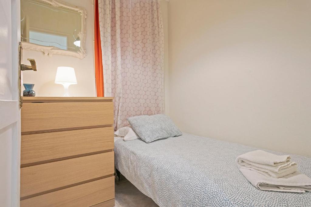 A bed or beds in a room at Apartmento Industria