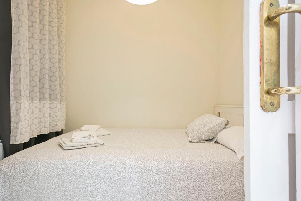 A bed or beds in a room at Apartmento Industria