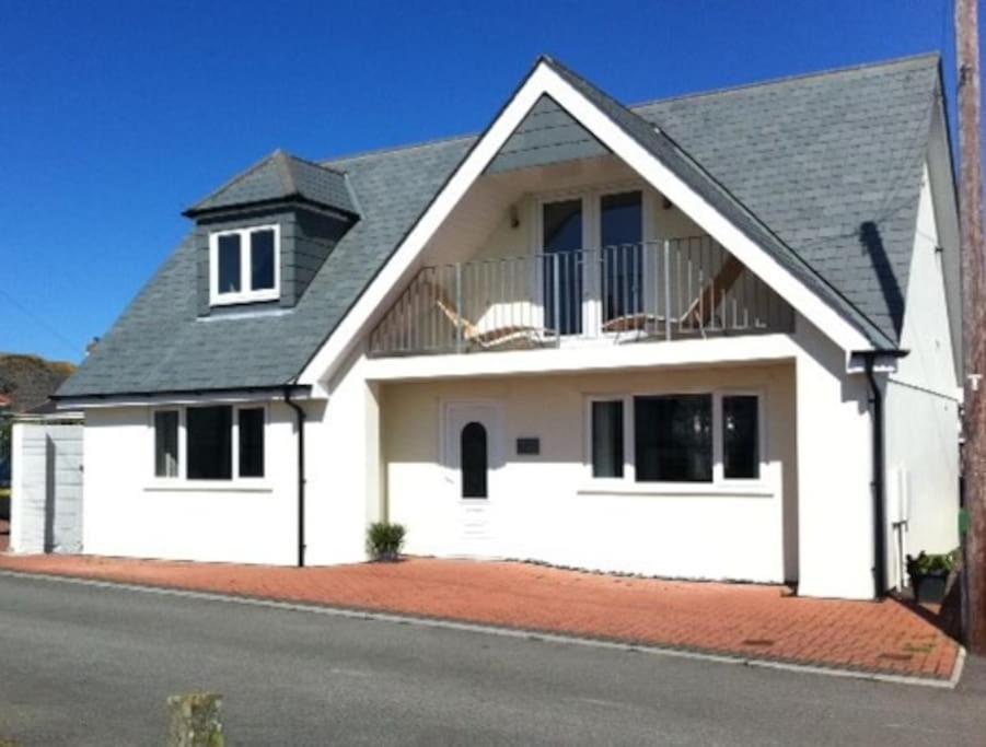 a white house with a black roof at Wonderful Beach House Just 250m From The Sea in Newquay