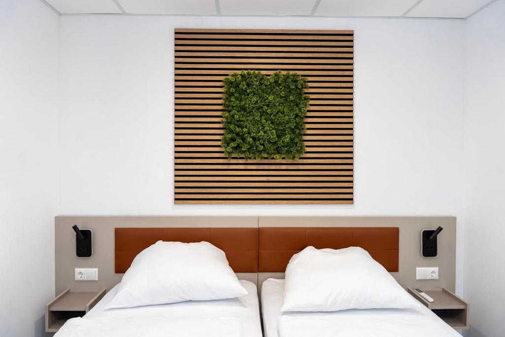 Ein Bett oder Betten in einem Zimmer der Unterkunft Comfort Housing Apartments