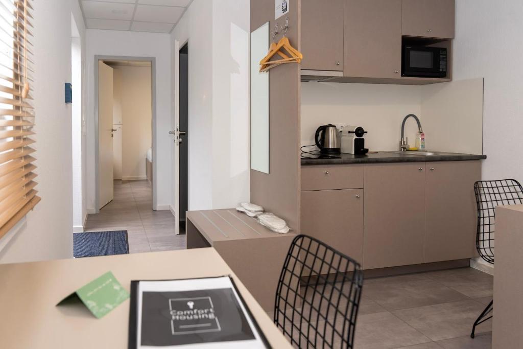 Küche/Küchenzeile in der Unterkunft Comfort Housing Apartments