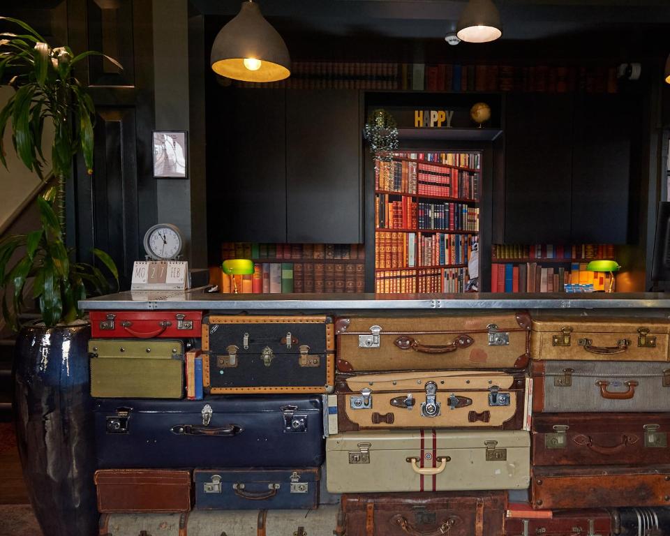 a bunch of suitcases stacked on top of each other at The California - London Kings Cross in London