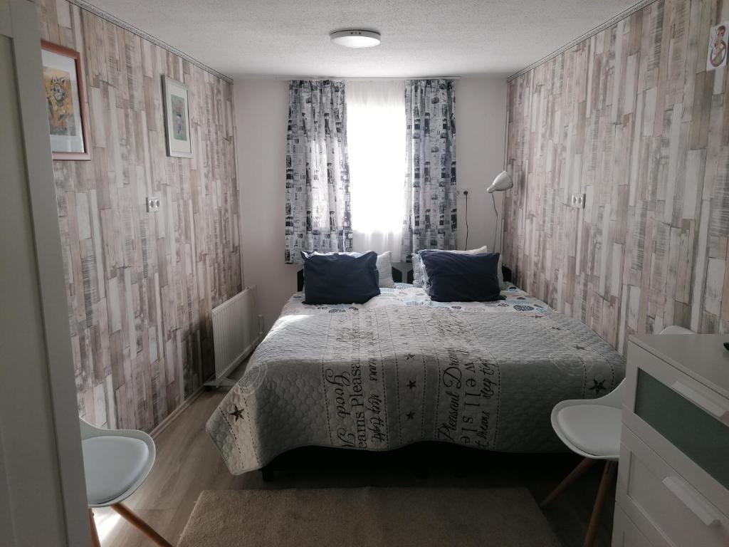 Postel nebo postele na pokoji v ubytování Tabán Apartman