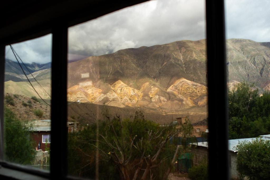a view of a mountain from a window at Vía Láctea in Tilcara