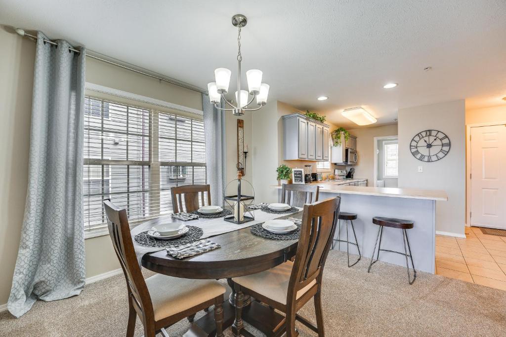 a dining room and kitchen with a table and chairs at Branson Condo with Pool about 3 Mi to Silver Dollar City in Branson West