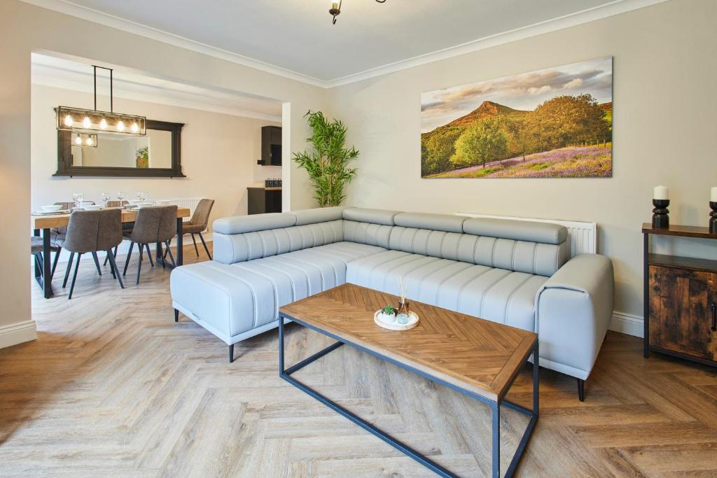 a living room with a couch and a table at Host & Stay - Roseberry Topping Townhouse in Great Ayton