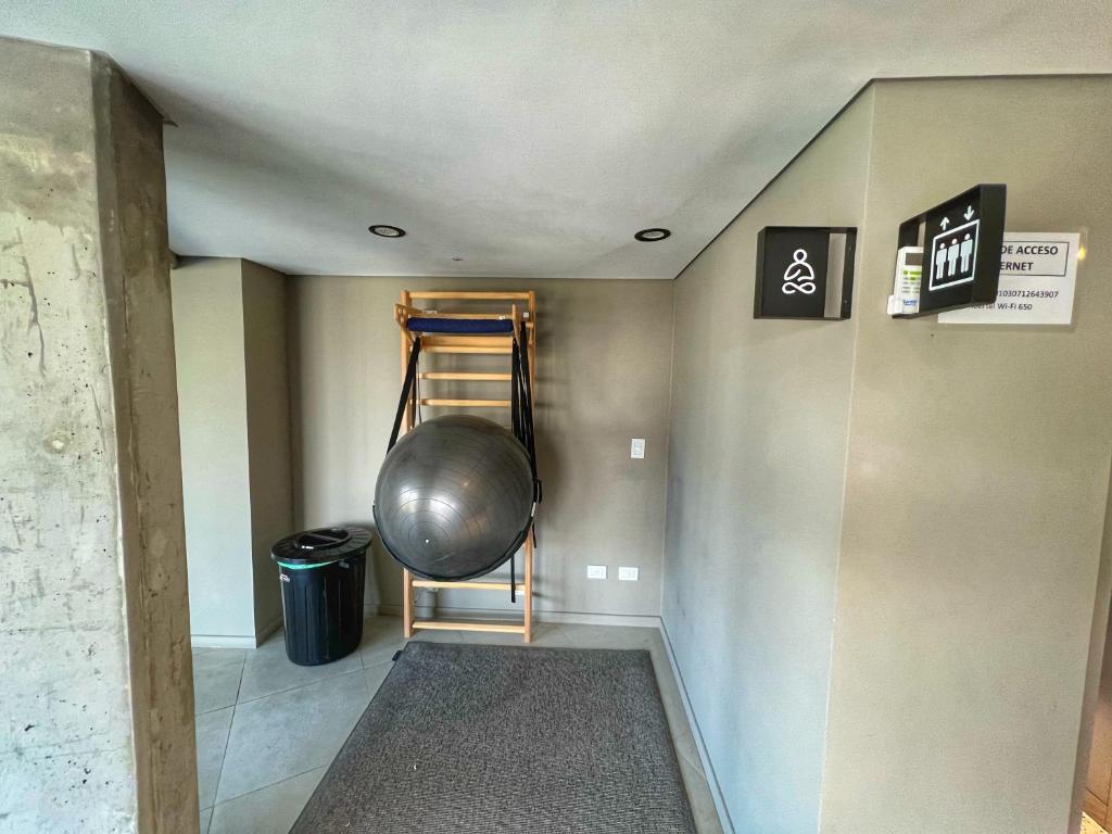 a room with a ladder and a metal ball on the wall at NUEVO Loft triple a 5 minutos de Puerto Madero 1A in Buenos Aires