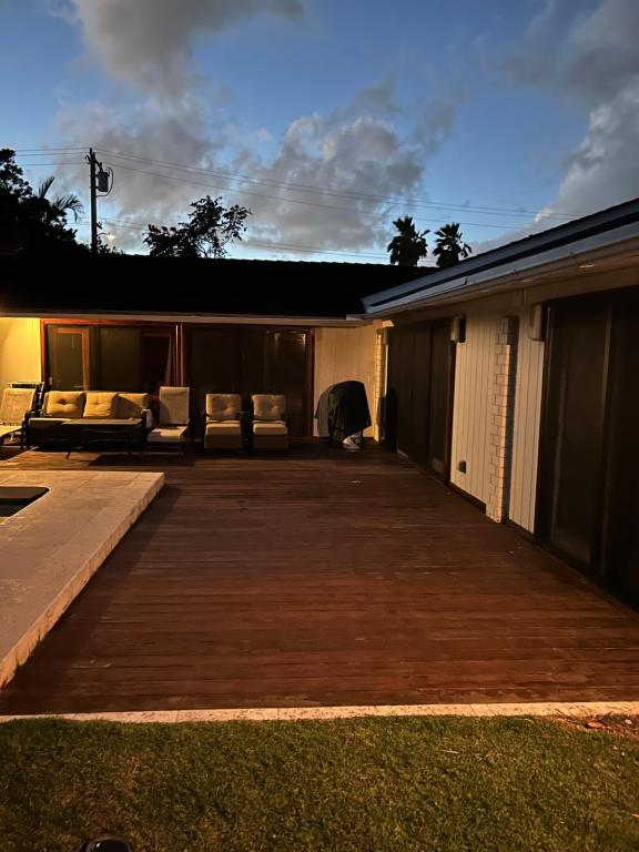 a porch of a house with a deck at Best Vacation rental house close to Kahala Beach ! in Honolulu