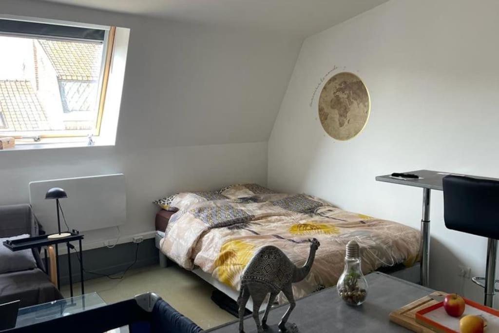 En eller flere senge i et værelse på Appartement Cosy le Bonduelle 2