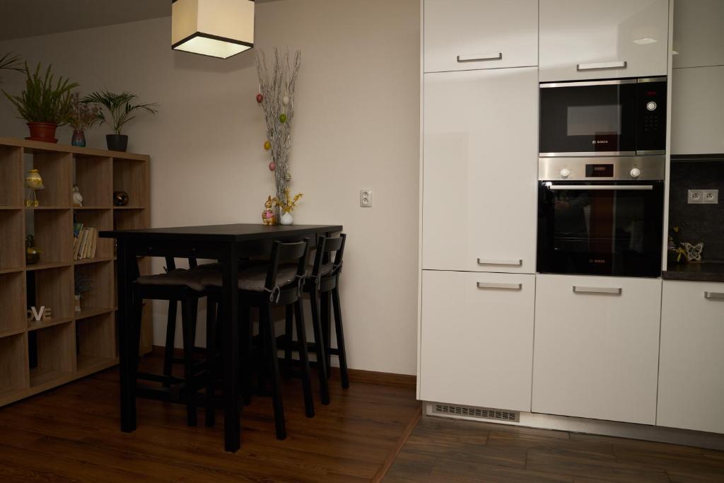 Kuchyňa alebo kuchynka v ubytovaní Apartman A&M
