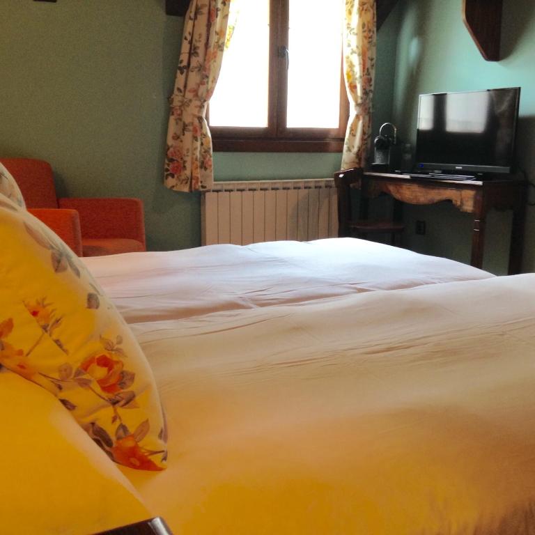 Postel nebo postele na pokoji v ubytování Hotel Casa Arcas
